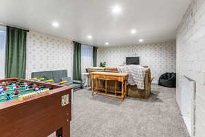Bedroom with light carpet and recessed lighting