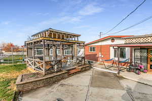 Rear view of property with a wooden deck