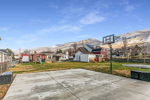 View of sport court with a mountain view and basketball court