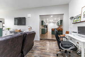 Office area with dark wood finished floors and baseboards
