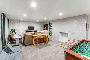 Living room with carpet flooring and recessed lighting