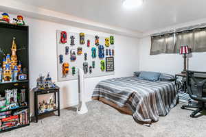 Carpeted bedroom with baseboards