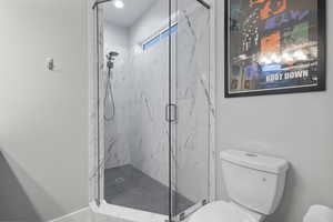 Bathroom featuring shower with glass door