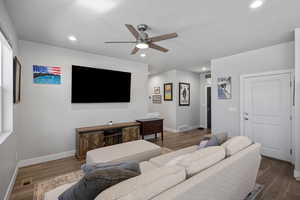 Family room with ceiling fan, wood finished floors, and recessed lighting