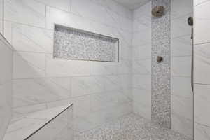 Bathroom featuring tiled shower