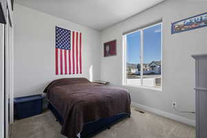 Bedroom with carpet and baseboards
