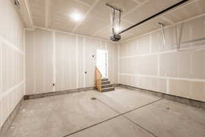 2 bay garage featuring a garage door opener