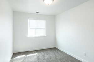 Carpeted upstairs bedroom