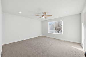 Empty room with carpet flooring, recessed lighting, and ceiling fan