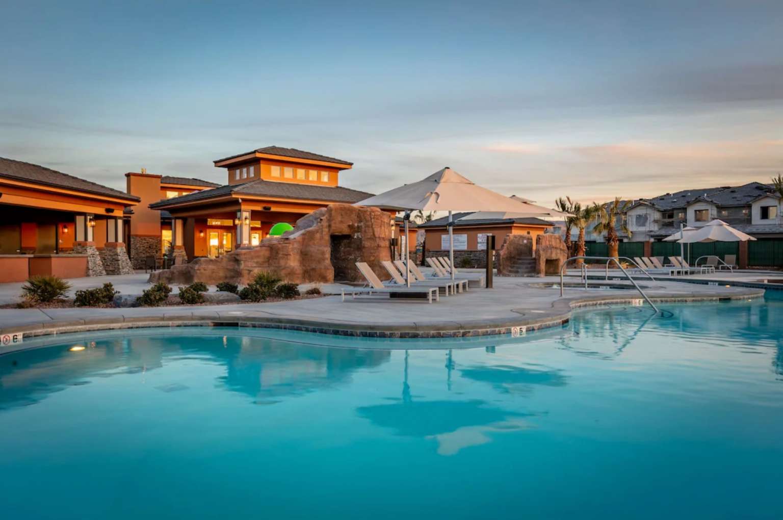 Community pool with a patio
