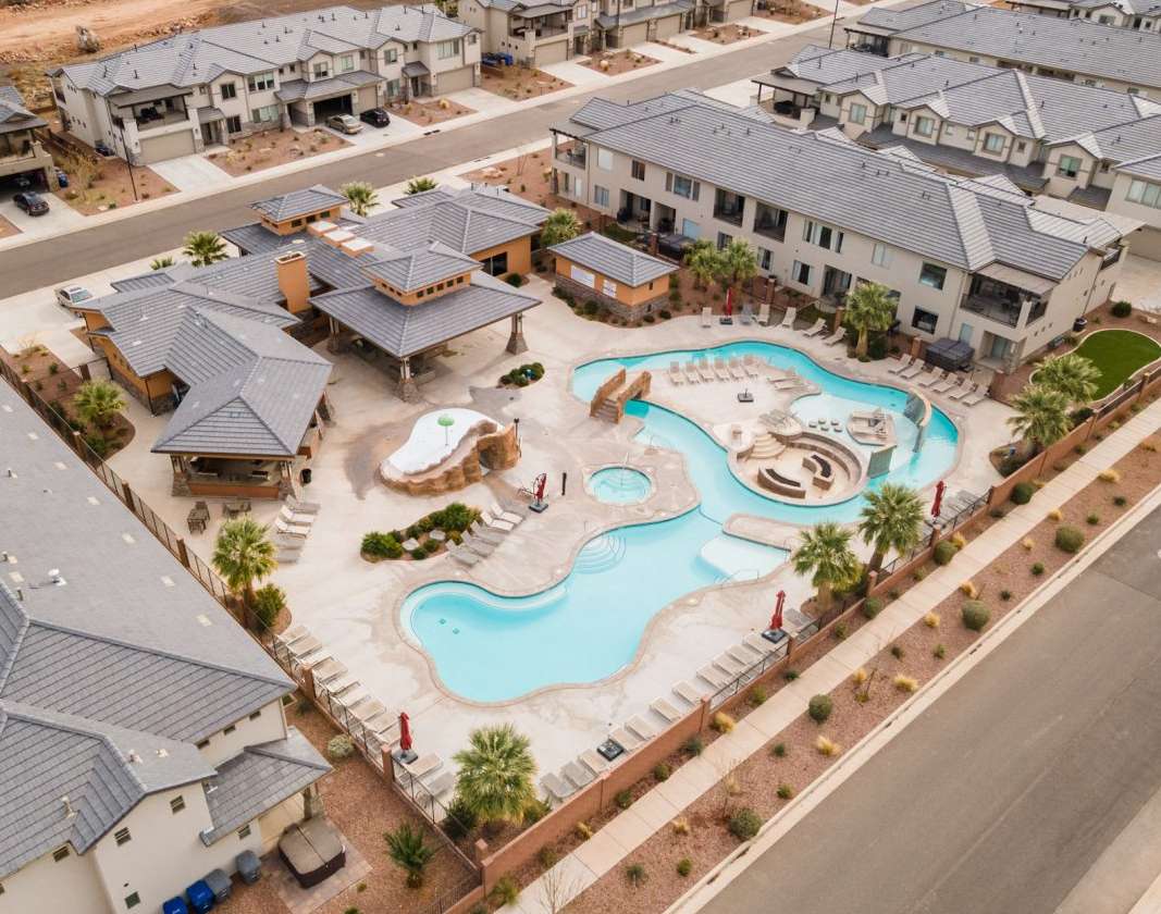 Aerial view of residential area featuring a pool