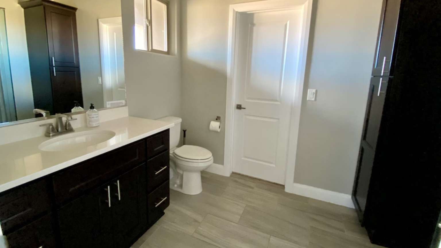 Bathroom featuring vanity and light wood-style flooring