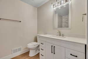 Bathroom featuring vanity and light wood-style floors
