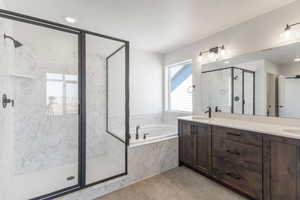 Full bathroom with double vanity, a garden tub, a marble finish shower, recessed lighting, and light tile patterned floors