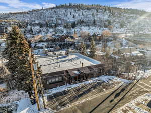 Snowy aerial view with a mountain view