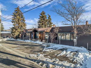 View of front facade featuring a chimney