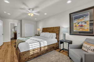 Bedroom with a closet, light wood-style flooring, recessed lighting, and a ceiling fan