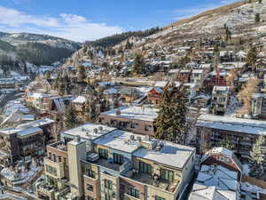 Snowy aerial view featuring a mountain view