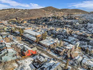 Snowy aerial view featuring a mountain view