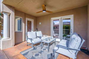 View of patio / terrace with a ceiling fan and an outdoor hangout area