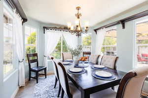 Dining area featuring a chandelier and plenty of natural light
