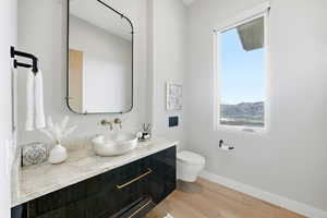 Bathroom with vanity and light wood-style floors