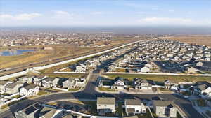 Aerial view of property's location with nearby suburban area and a large body of water