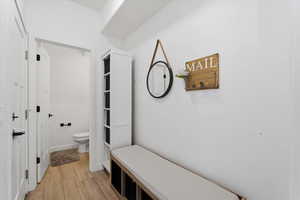 Bathroom featuring light wood-style flooring and toilet
