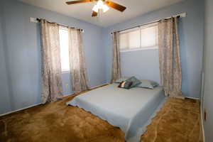 Bedroom featuring carpet flooring and ceiling fan