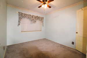 Bedroom featuring carpet floors and a ceiling fan