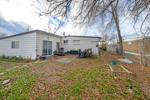 Rear view of property with a patio area