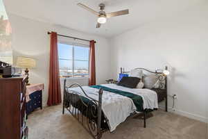 Bedroom with carpet flooring and a ceiling fan