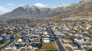 Aerial overview of property's location with nearby suburban area and mountains