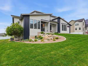 Rear view of property featuring a patio area