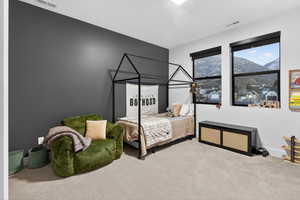 Carpeted bedroom featuring a mountain view