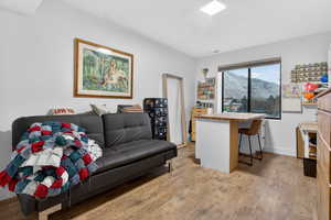Living room featuring light wood-style floors and a mountain view