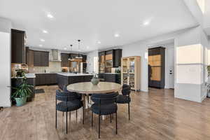 Dining room featuring light wood finished floors and recessed lighting