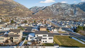 Aerial perspective of suburban area featuring a mountain backdrop