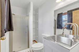 Full bath with vanity and a stall shower