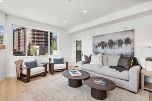 Living room featuring recessed lighting and light wood-style floors