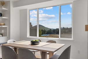 Dining room with a mountain view and healthy amount of natural light