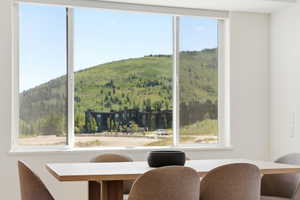 Expansive triple-pane window with a white frame, offering abundant natural light