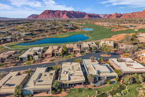 View of property location featuring a water and mountain view and nearby suburban area