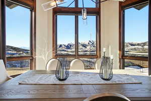 Dining space featuring a mountain view and plenty of natural light