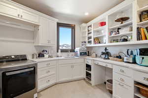 Laundry area featuring washer / dryer and recessed lighting