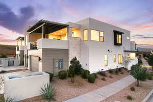 End unit with upper patio, 2 car garage, 2 parking spaces, and adjacent to street parking