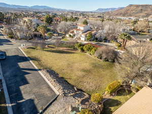 Aerial overview of property's location with mountains and nearby suburban area