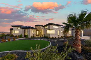 View of front of house with a front lawn and stone siding