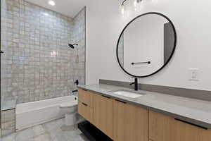 Full bath featuring vanity,  shower combination, and recessed lighting