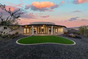 Rear view of property featuring stucco siding and a patio